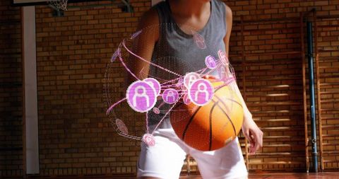 Teen athlete dribbling basketball with augmented reality hologram overlay in gym training
