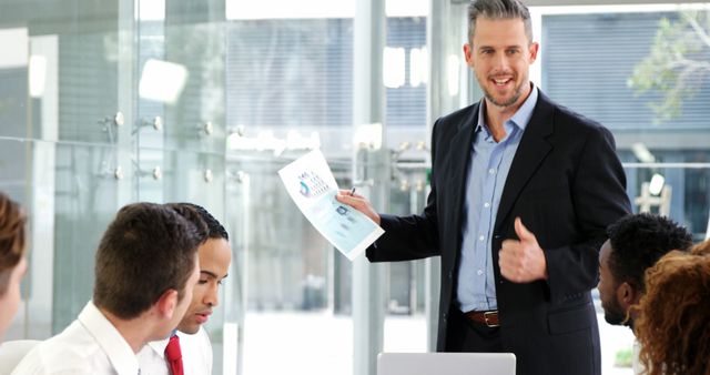 Businessman Leading Team Meeting in Modern Office - Download Free Stock Images Pikwizard.com