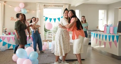 Diverse Friends Celebrating Baby Shower with Joy and Unity