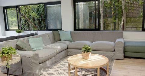 Modern Minimalist Living Room with Grey L-Shaped Sofa