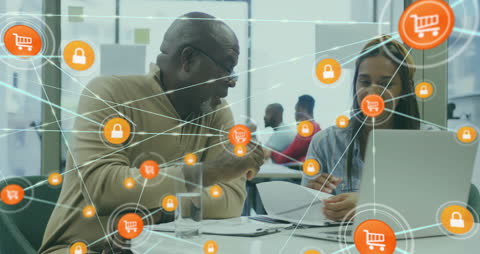 Diverse Team Discussing E-Commerce Strategies and Cybersecurity in Office