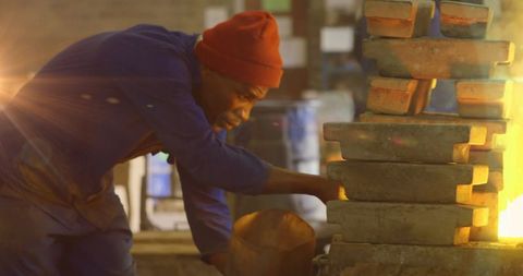 African american worker in workshop with warm lighting