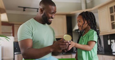 African American Father and Daughter Reading Label in Kitchen - Download Free Stock Images Pikwizard.com