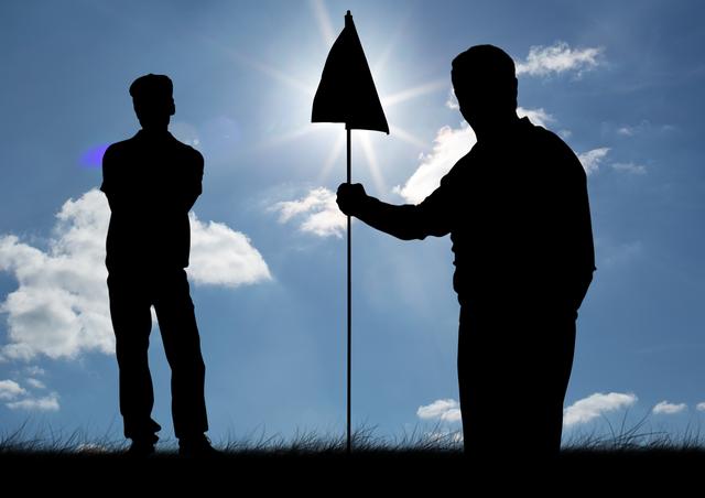 Digital composite image of silhouette golfer holding golf flag on a sunny day