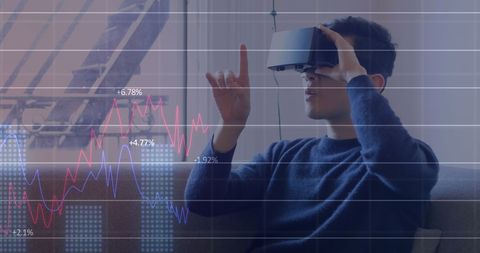 Young man experiencing virtual reality with financial graph overlay