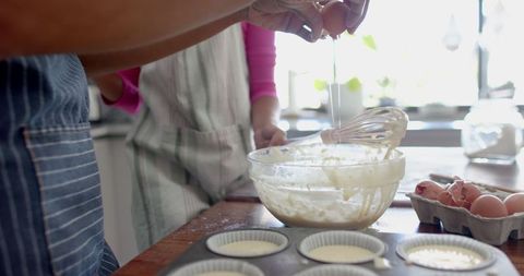 Mother and Daughter Baking Cupcakes in Warm Sunlit Kitchen - Download Free Stock Images Pikwizard.com