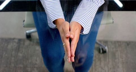 Professional with Enthusiastic Hand Gestures in Business Meeting
