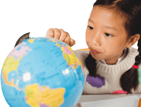 Curious student examining colorful globe with focus and curiosity