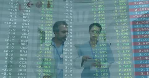 Healthcare Professionals Reviewing Financial Data Overlay on Tablet