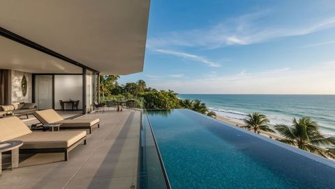 Oceanfront Luxury Villa with Glass-Edged Infinity Pool and Sun Loungers Overlooking Beach