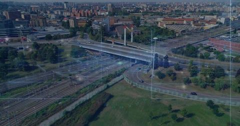 Aerial highway overpass and rail junction with digital grid overlay for smart city design