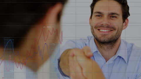 Business Team Shaking Hands with Financial Graph Overlay