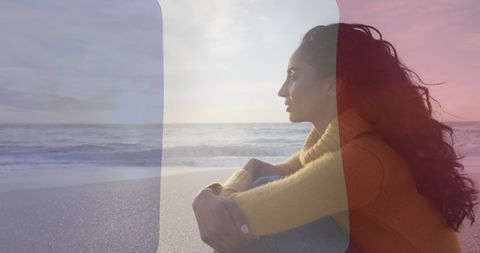Biracial Woman Embracing French Patriotism at Beach