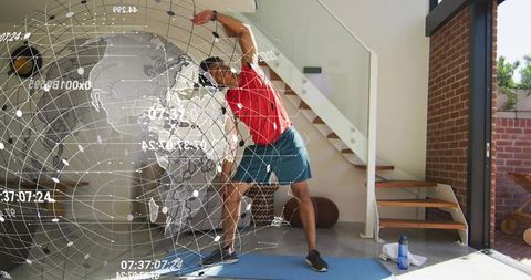 Man Stretching with Holographic Globe in Home Gym