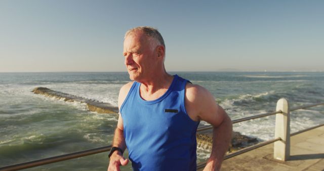 Senior Man Running By Ocean at Sunset - Download Free Stock Images Pikwizard.com