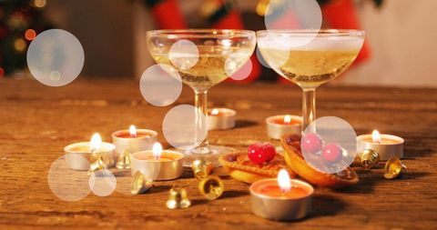 Festive Christmas Celebration with Champagne and Candles - Download Free Stock Images Pikwizard.com
