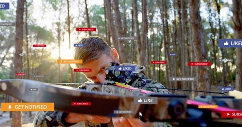 Backlit archer aiming crossbow in forest with social media like subscribe notify badges