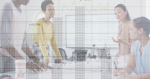 Diverse Business Team Overlaid with Financial Data Graphs
