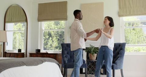 Couple sharing intimate moment in cozy bedroom