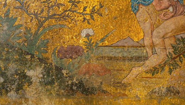 Gilded allegory panel featuring stylized figure with leaf branch and floral ornament