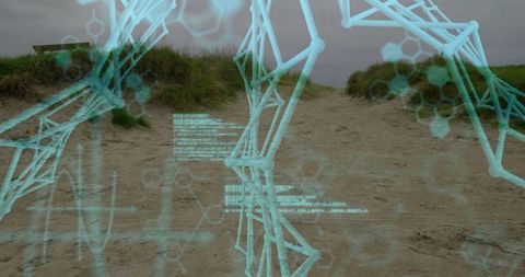 Futuristic digital wireframe overlay on coastal dune pathway
