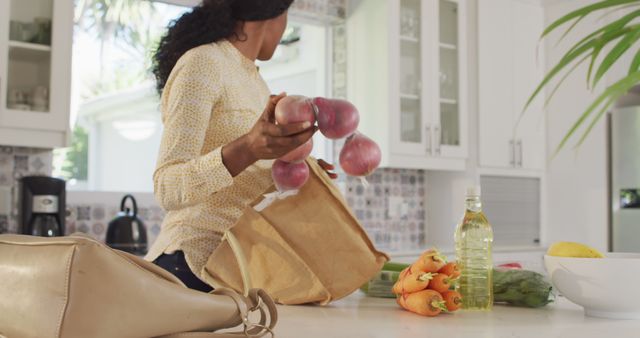 Woman Unpacking Fresh Produce in Modern Kitchen - Download Free Stock Images Pikwizard.com