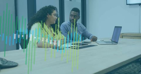 Diverse Professionals Discussing Financial Data with Digital Interface