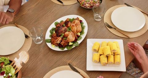 Family Gathering Enjoying Roast Chicken and Seasonal Meal