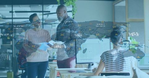 Business professionals collaborating with global network overlay