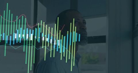 Pensive mature professional gazing through office window with stock market data overlay