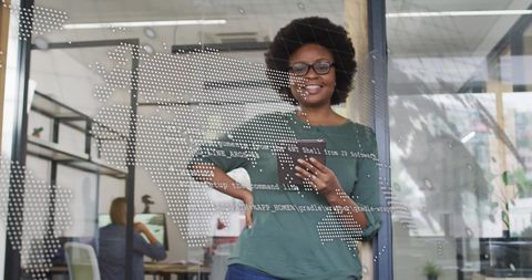 Confident businesswoman using tablet with global business interface