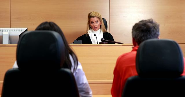 Judge Presiding Over Court Case with Two Defendants - Download Free Stock Images Pikwizard.com