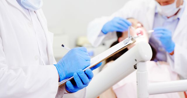 Dentists Wearing Gloves Treating Patient in Dental Clinic - Download Free Stock Images Pikwizard.com