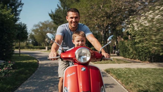 Father and son riding red scooter on suburban sidewalk, smiling and bonding on sunny day