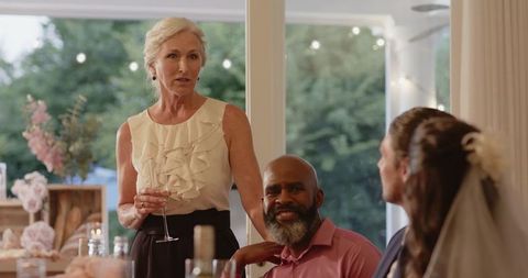 Elegant Woman Giving Wedding Toast at Reception