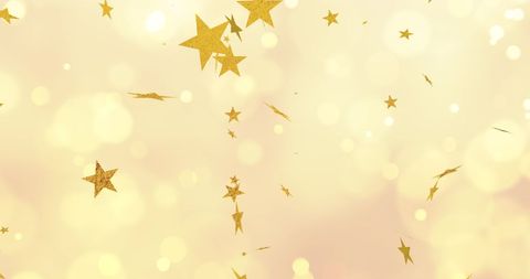 Golden Stars Floating in Ethereal Sparkling Light Background