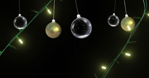 elegant christmas decoration with swinging baubles and string lights - Download Free Stock Images Pikwizard.com