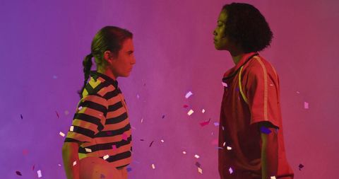 Celebration with Diverse Female Rugby Players Under Falling Confetti