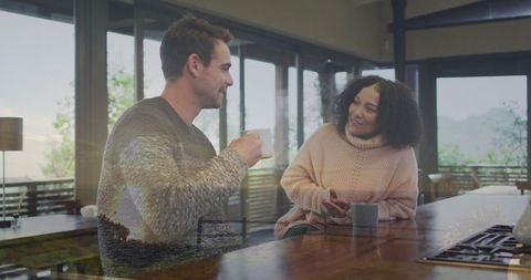 Relaxed Couple Enjoying Coffee in Modern Kitchen
