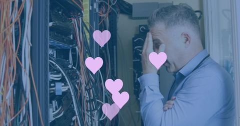 Frustrated it professional in server room with romantic overlay