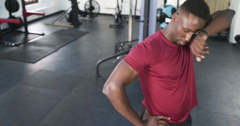 Fit African American Man Cooling Off After Intense Workout in Gym