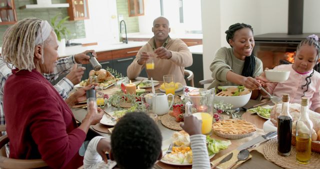 African american parents, children and grandparents celebrating at thanksgiving dinner, slow motion - Download Free Stock Photos Pikwizard.com