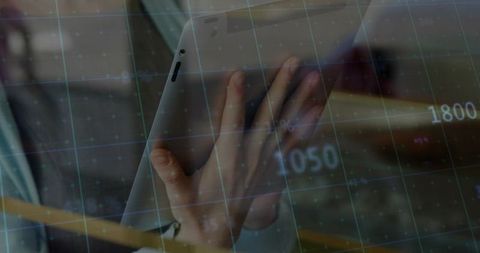 Professional analyzing digital data on tablet in modern office