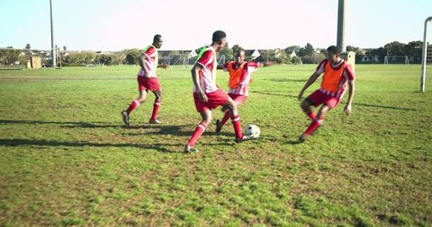 Soccer Team Practicing Passing Drills on Grass Field