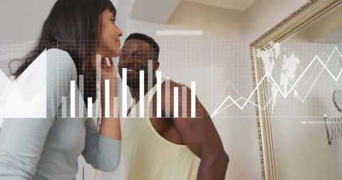 Diverse Couple Engaging with Digital Data Interface in Mirror