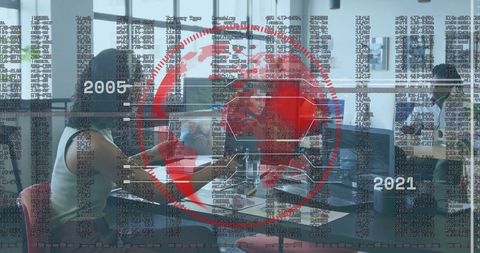 Professionals Analyzing Digital Reports in Modern Office