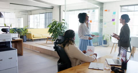 Team Collaboration in Modern Office with Diverse Professionals