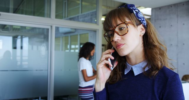 Focused Businesswoman Taking Important Call at Modern Office - Download Free Stock Images Pikwizard.com