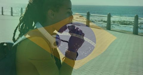Woman relaxing on seaside walkway eating snack