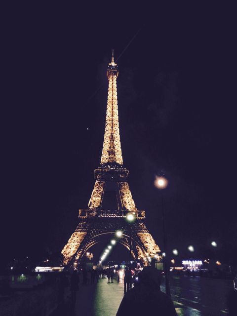 Eiffel Tower Lit Up at Night in Paris - Download Free Stock Photos Pikwizard.com